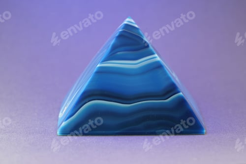 Preview: Blue granite crystal pyramid on a purple background