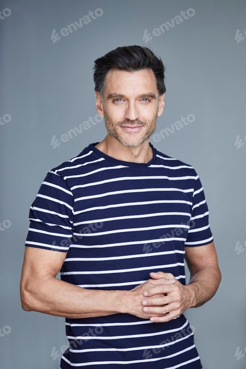 Preview: Portrait of man with stubble wearing striped t-shirt