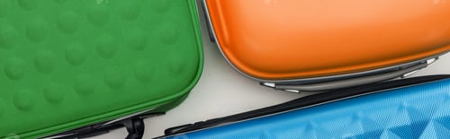 Preview: panoramic shot of bright travel bags on white background