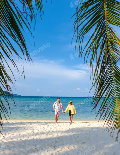 Preview: A couple of men and women walking on the beach of the tropical Island Koh Lipe Southern Thailand