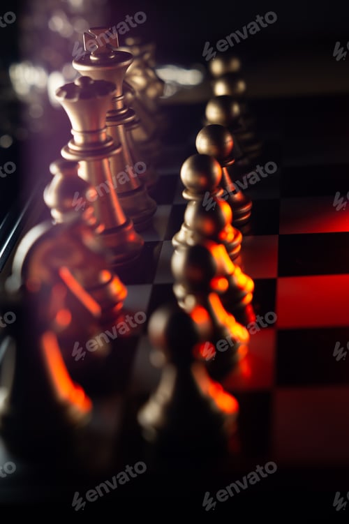 Preview: Closeup shot of the white chess pieces on the chessboard in red lights