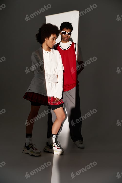 Preview: Young couple exudes love and style in an artistic indoor setting with captivating shadows