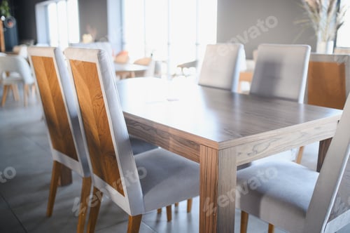 Preview: Modern dining table and chairs in furniture showroom