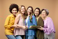 Preview: Five Smiling Women Posing Together in Studio