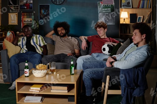 Preview: Multi-ethnic Friends Watching TV In Evening