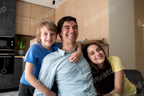 Preview: Father Smiling with his Children in Modern Home