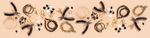 Preview: Tools and accessories for DIY jewelry in the workplace. Flat lay on beige background