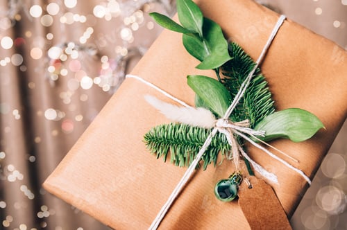 Preview: Gift Wrapped in Brown Paper with Greenery
