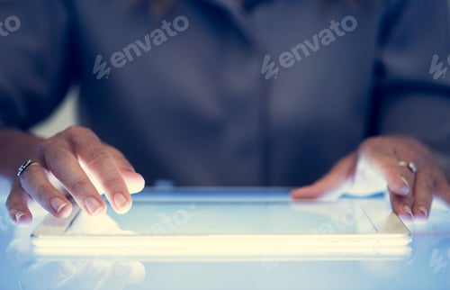 Preview: Hands holding using digital tablet on a cyber space table