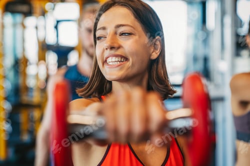 Preview: Close up image of attractive fit woman in gym