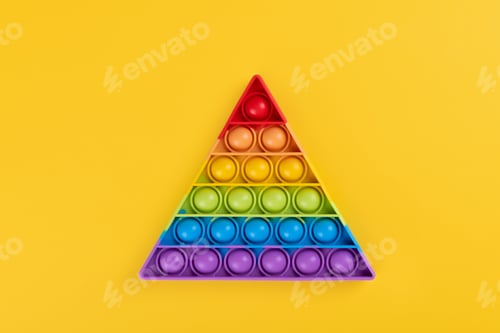 Preview: Bright rainbow toy antistress for children and adults on a yellow background