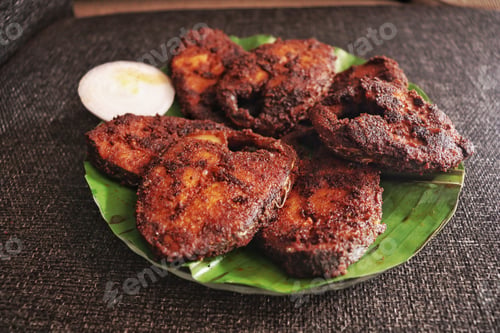 Preview: Closeup of fried tasty seafood on plate in Kerala tyle