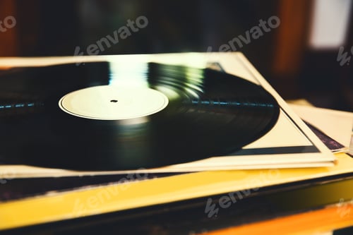 Preview: Vinyl record and a collection of albums