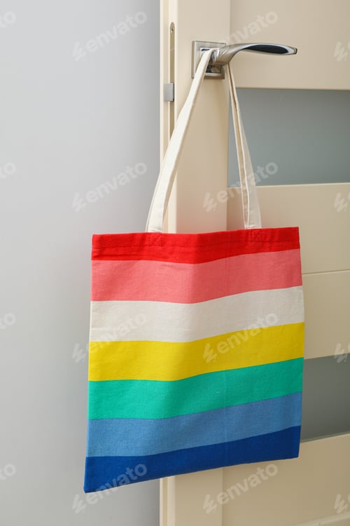 Preview: Concept of lgbt parade, rainbow shopper, on color background.