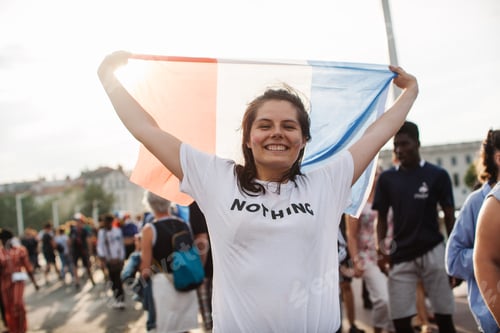 Preview: Happy french woman wearing a white t-shirt