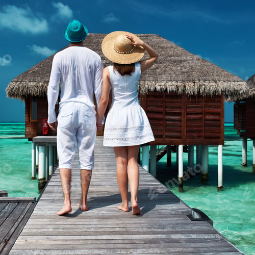 Preview: Couple On A Tropical Beach Jetty At Maldives