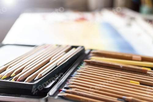 Preview: Box of colorful pencils on a table