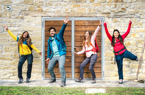 Preview: Happy friends having fun at countryside trekking cottage posing for group photo