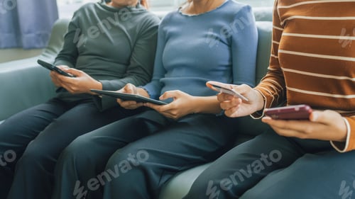 Preview: My device of three people as mother, daughter and friends watching social media news, using laptop