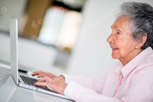 Preview: Elder Woman Using A Computer And Looking Very Happy