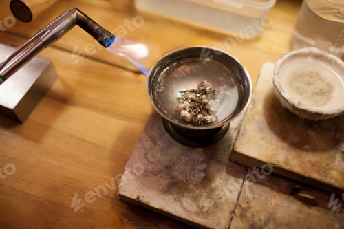 Preview: Welding torch melting the silver ornaments