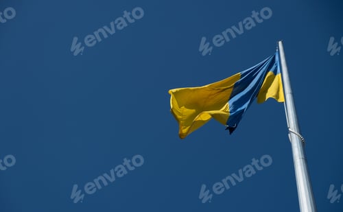 Preview: Flag of Ukraine flutters in blue sky. Large yellow blue Ukrainian national state flag. War