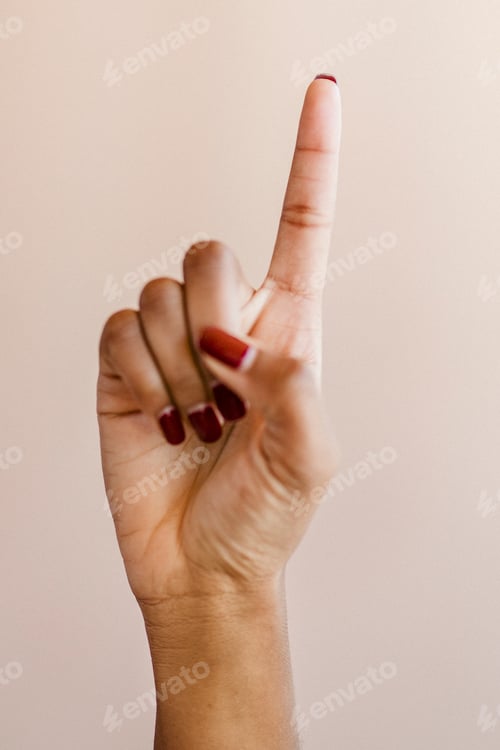 Preview: Woman's hand showing number one