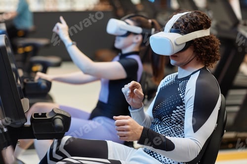Preview: Man Wearing VR Headset on Exercise Bike in Gym