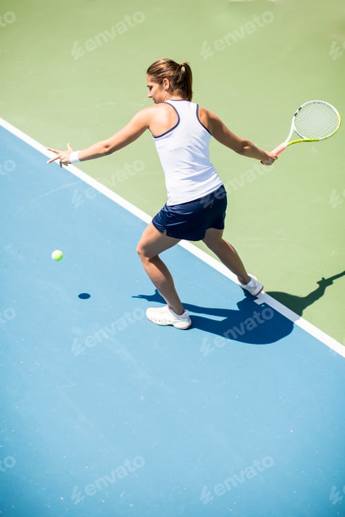 Preview: Young woman playing tennis