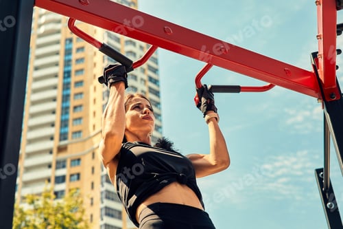 Preview: Photo of young european woman on a street workout in sports park on sunny day. Concept of training