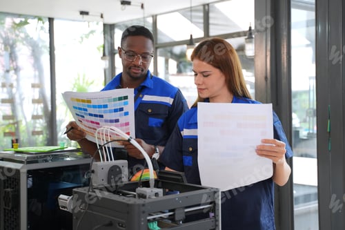 Preview: Engineers are working at 3D printing workshop.