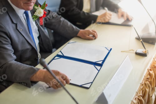 Preview: Business man signing a contract. space of paper for you edit.