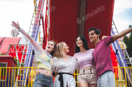 Preview: Cheerful diverse people hurting in the theme park, group of friends having fun and relaxing