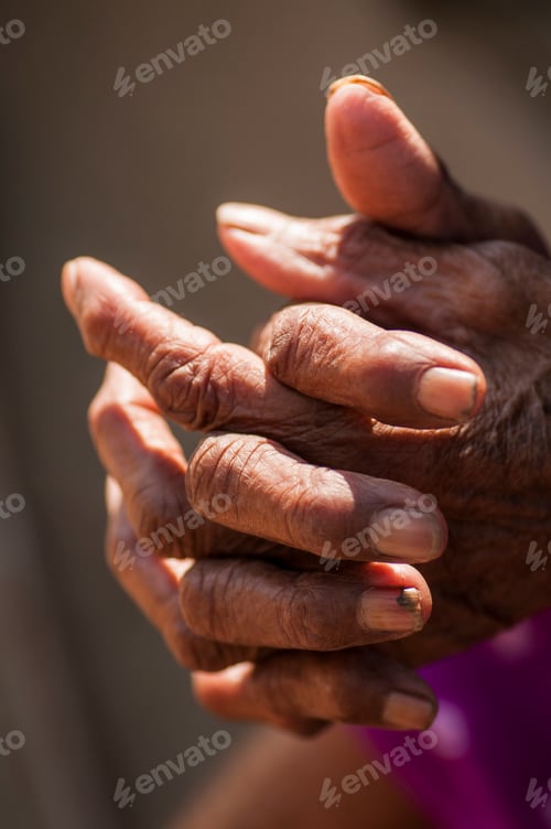 Preview: Close-up of senior woman's hands joined together for praying
