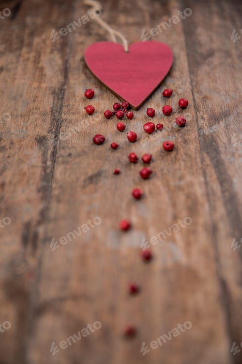 Preview: Heart is spreading Love. Wooden background. Love and Valentine Day Concept