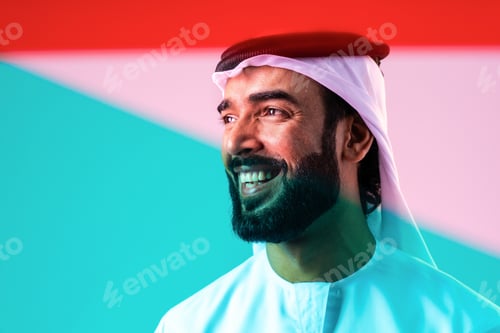 Preview: Arab businessman wearing emirati kandura portrait in studio