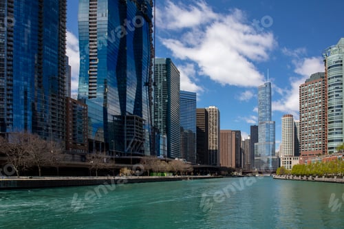 Preview: USA Chicago city waterfront skyscraper modern glass building on the river canal, blue cloudy sky.