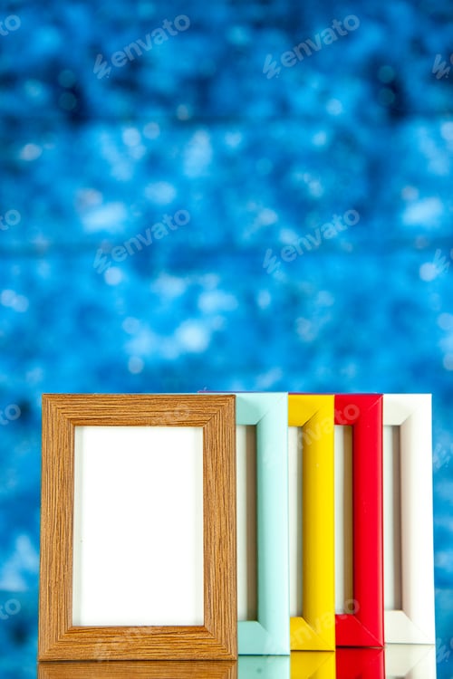 Preview: front view different picture frames with colored corners on blue background picture portrait family