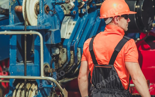 Preview: Heavy Machines Operator Worker in Front of Large Crane