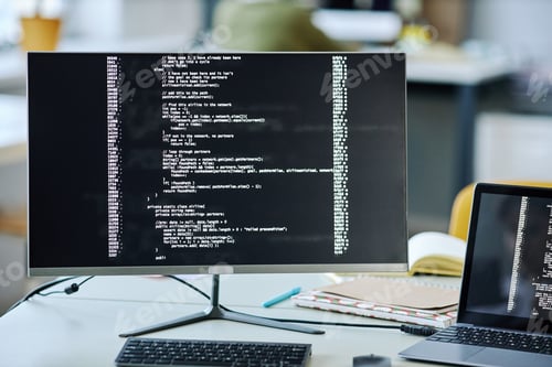 Preview: Background image of computer screen with code lines on desk in office