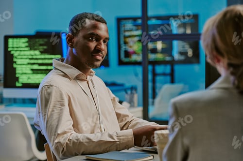 Preview: Young Black Man During Meeting In IT Office