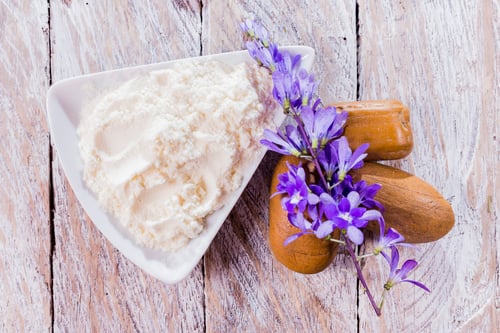 Preview: Bowl with hydrolyzed collagen, on rustic wooden background, top view