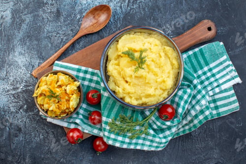 Preview: Above view of mashed potatoes served with dill and delicious dish fresh tomatoes on green stripped