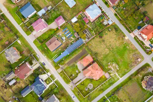 Preview: Aerial view of home roofs in residential rural neighborhood area