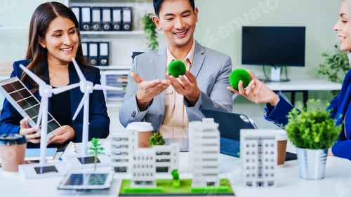 Preview: Trio of businesspeople, including a middle-aged Asian man and woman, strategize at their desk