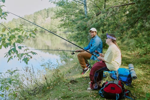 Preview: Young Man and Girl with Down Syndrome Fishing Together by Forest Lake