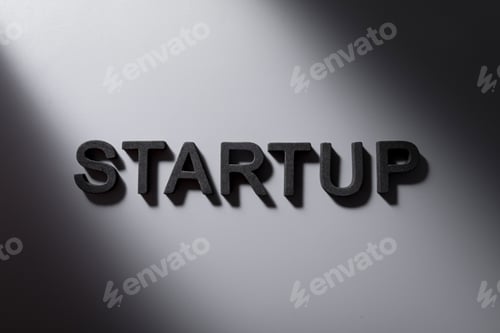 Preview: Top view shot of Startup word on a gray background