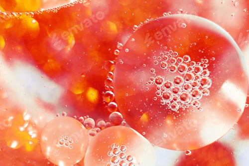 Preview: Oil bubbles close up. a circles of water macro. abstract orange and fiery red background