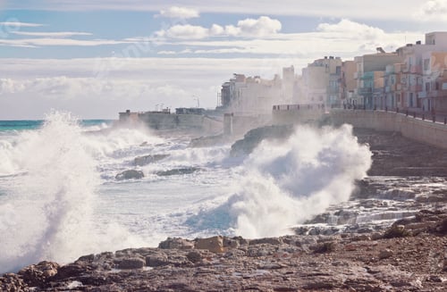 Preview: Strong waves and splashes in the sea after a storm on the coast of a village in Malta