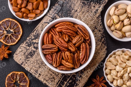 Preview: Delicious nutritious pecan nuts in ceramic bowl